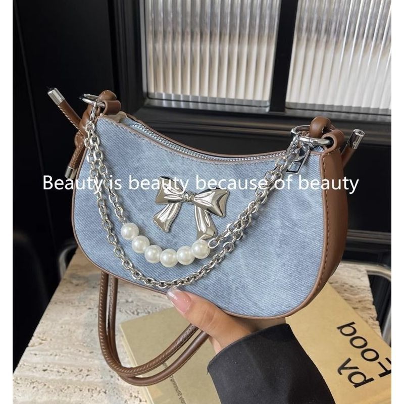 Luxury Bags In China Wholesale - 高品質人気販売卸売ニッチデザインパールボウ軽量ショルダーバッグファッション高級チェーンピーバッグクロスボディバッグ女性用